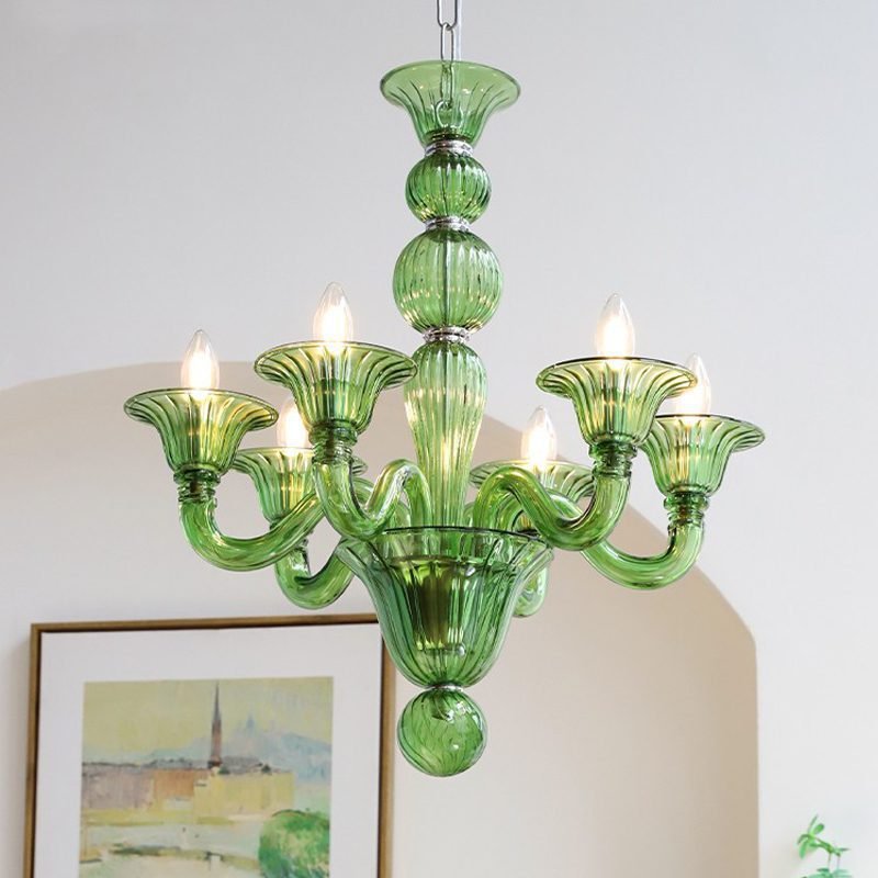 Vintage green glass chandelier with Murano style design, hanging in a room with art and arched wall, ideal for living room and dining room decor