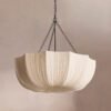 Modern retro pleated fabric pendant chandelier in cream, hanging with black chains against a neutral wall, ideal for living room and dining room decor