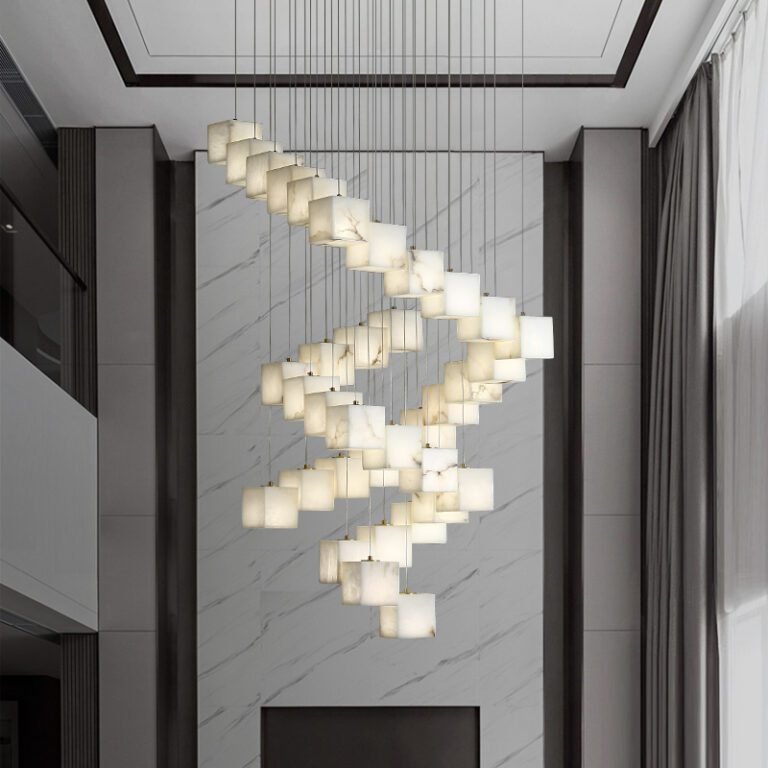 Luxury spiral alabaster cube pendant chandelier with natural marble shades, hanging in a room with dark walls, ideal for vaulted ceilings, villas and grand living spaces