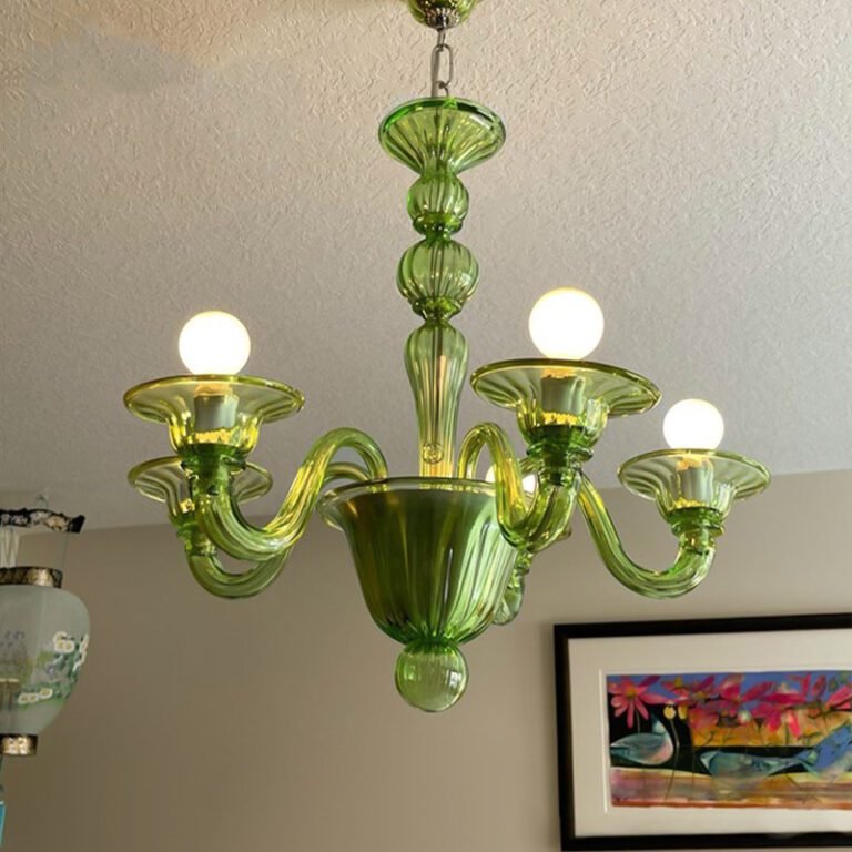 Vintage green glass chandelier with Murano style design, hanging in a room with art and arched wall, ideal for living room and dining room decor