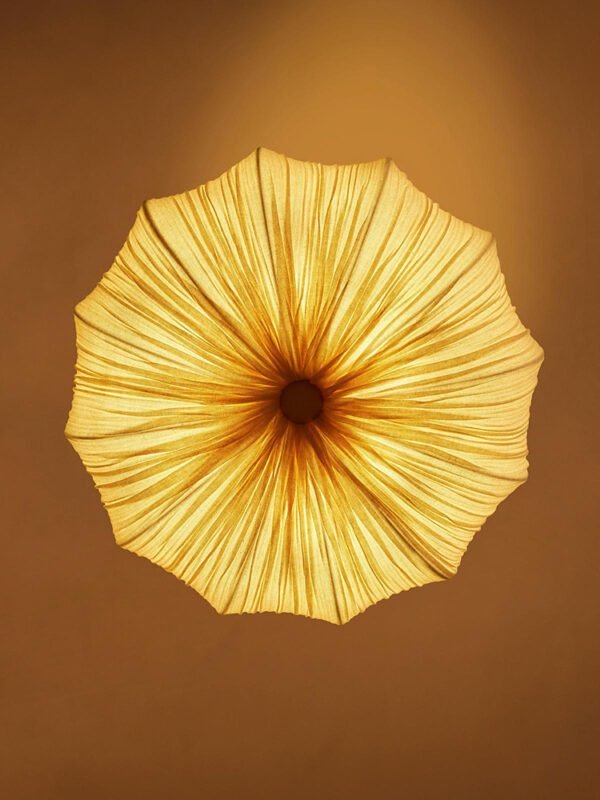 Modern retro pleated fabric pendant chandelier in cream, hanging with black chains against a neutral wall, ideal for living room and dining room decor