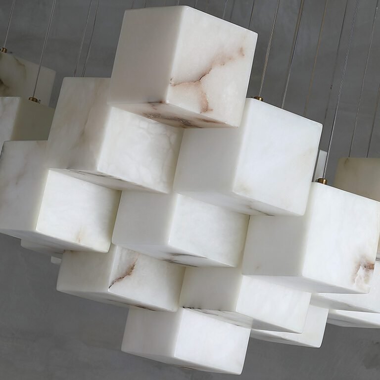 Luxury spiral alabaster cube pendant chandelier with natural marble shades, hanging in a room with dark walls, ideal for vaulted ceilings, villas and grand living spaces