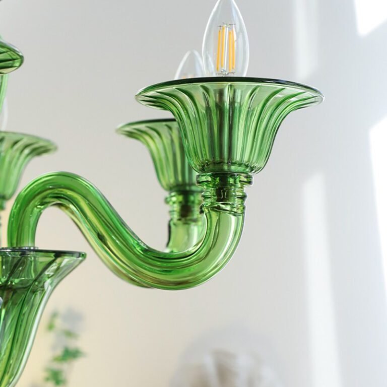 Vintage green glass chandelier with Murano style design, hanging in a room with art and arched wall, ideal for living room and dining room decor