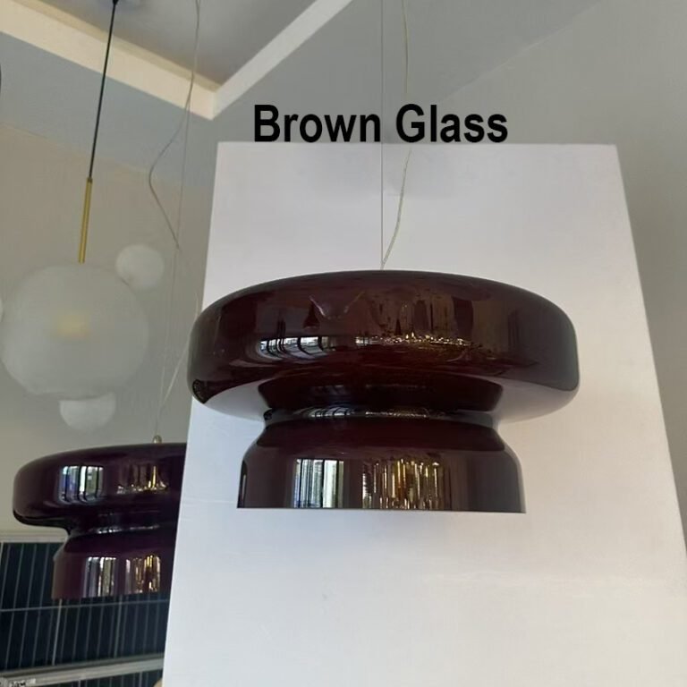 Retro modern amber glass pendant light with brown glass shade, hanging against a white background, ideal for living room and dining room decor